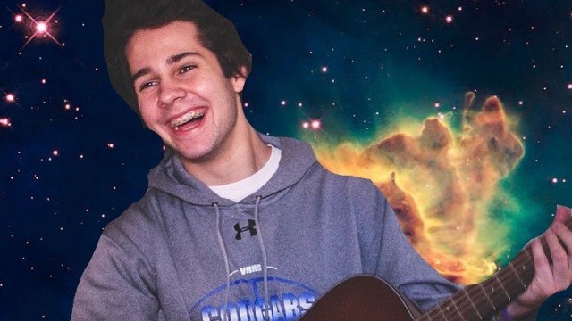 David Dobrik playing guitar with cosmic background
