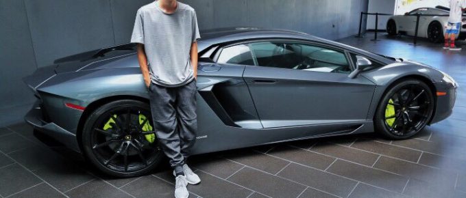 Tanner Braungardt posing next to a Lamborghini