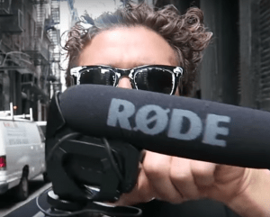Casey Neistat holding a Rode VideoMic Pro