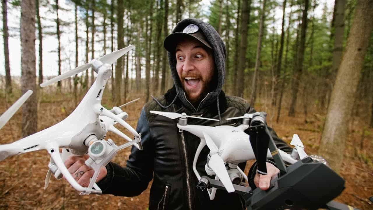 Peter McKinnon holding two drones