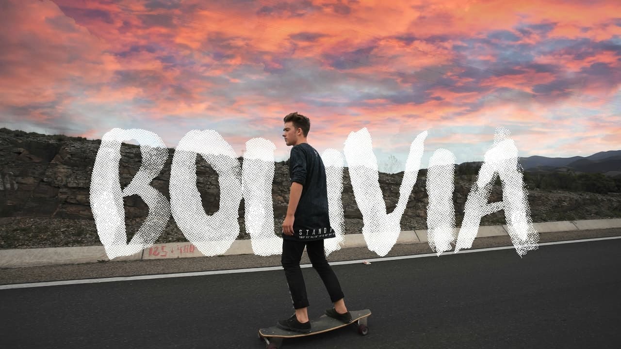Sam Kolder riding a skateboard down the road