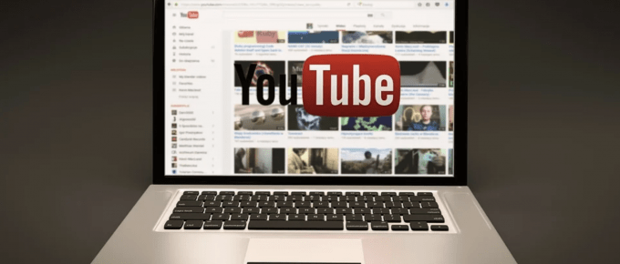 Gray background laptop with youtube logo