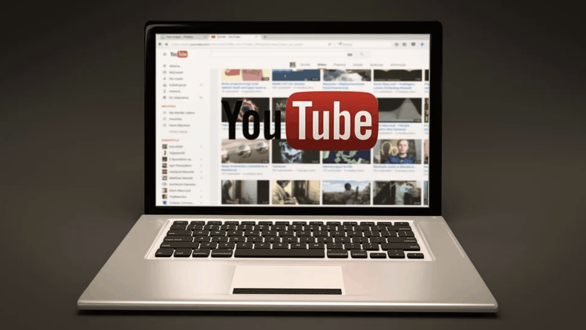 Gray background laptop with youtube logo